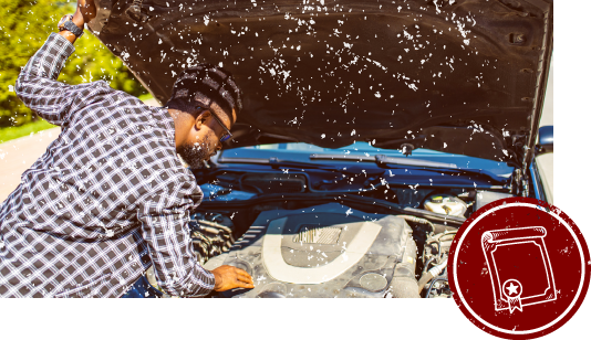 ボンネットを開けている整備士